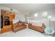 Open-concept living space with a view of the kitchen, fireplace, and comfortable seating area at 8707 E Florida Ave # 510, Denver, CO 80247