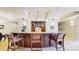 Inviting bar area boasts ample counter space, wooden cabinetry, and stylish pendant lighting for entertaining in style at 2500 E Cherry Creek South Dr # 213, Denver, CO 80209