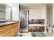 Bathroom features a soaking tub, tiled shower, granite counters and wood cabinets at 2500 E Cherry Creek South Dr # 213, Denver, CO 80209