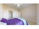 Bright bedroom features neutral carpet, ceiling fan, and a walk in closet at 2500 E Cherry Creek South Dr # 213, Denver, CO 80209