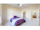 Bright bedroom features neutral carpet, ceiling fan, and an ensuite bath at 2500 E Cherry Creek South Dr # 213, Denver, CO 80209