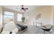 Bright bedroom with a large windows, modern furniture and a unique geometric rug at 2500 E Cherry Creek South Dr # 213, Denver, CO 80209