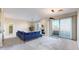 Spacious living room featuring a fireplace, balcony access, and sleek modern furnishings at 2500 E Cherry Creek South Dr # 213, Denver, CO 80209