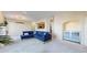 Open-concept living room features a modern chandelier and plenty of space at 2500 E Cherry Creek South Dr # 213, Denver, CO 80209