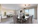 Bright living room and dining room with a fireplace, plush seating, and lots of natural light at 2500 E Cherry Creek South Dr # 213, Denver, CO 80209