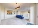 Bright and airy living room with an open-concept kitchen, modern furnishings, and lots of natural light at 2500 E Cherry Creek South Dr # 213, Denver, CO 80209
