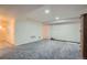 Spacious basement featuring neutral walls, new carpet, with ample potential for customization and storage solutions at 6776 E Panorama Ln # C1, Denver, CO 80224