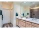 Bathroom with double sinks, lots of light, and a well-lit mirror at 6776 E Panorama Ln # C1, Denver, CO 80224