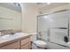 Well-maintained bathroom featuring a shower-tub combo, a mirrored vanity, and a functional toilet at 6776 E Panorama Ln # C1, Denver, CO 80224