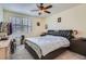 Spacious bedroom with a large window and a comfortable king bed at 6776 E Panorama Ln # C1, Denver, CO 80224