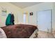 Bedroom with a brown bed, and a closet at 6776 E Panorama Ln # C1, Denver, CO 80224