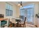 Cozy dining area with modern lighting and a view to the outside at 6776 E Panorama Ln # C1, Denver, CO 80224