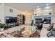 Inviting living room featuring a fireplace, display cabinet, and open layout at 6776 E Panorama Ln # C1, Denver, CO 80224