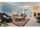 Comfortable living room area with bright windows and adjacent breakfast bar at 6776 E Panorama Ln # C1, Denver, CO 80224