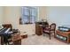 Bright office space with a large window and traditional desk at 6776 E Panorama Ln # C1, Denver, CO 80224