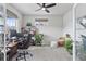 Bright home office with large window, a ceiling fan, and comfortable work space at 23913 E Minnow Cir, Aurora, CO 80016