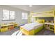 Fun yellow bunk bed and storage in bedroom at 3754 S Mission Pkwy, Aurora, CO 80013