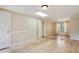 Spacious living room with hardwood floors, a skylight, and plenty of natural light at 7526 W Ottawa Pl, Littleton, CO 80128