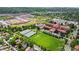 Expansive aerial view of surrounding sports fields and community amenities, a neighborhood with lots of green space at 1366 S Vine St, Denver, CO 80210
