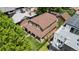 Aerial view of a brown home with a lush green lawn and a black metal fence at 1366 S Vine St, Denver, CO 80210