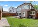 Backyard featuring a wood deck with outdoor seating, lawn, and fenced perimeter at 1366 S Vine St, Denver, CO 80210