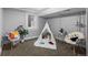 Finished basement area featuring a cute play area and neutral walls at 1366 S Vine St, Denver, CO 80210
