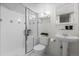 Bathroom featuring white tile, a glass-enclosed shower, and a pedestal sink at 1366 S Vine St, Denver, CO 80210