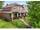 Stunning two-story home with a manicured front yard and inviting porch at 1366 S Vine St, Denver, CO 80210