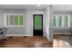 Bright foyer with hardwood floors, decorative front door, and ample natural light at 1366 S Vine St, Denver, CO 80210