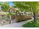 Beautiful home exterior with a well-maintained lawn and stylish retaining wall at 1366 S Vine St, Denver, CO 80210