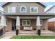 Charming front porch with stone flooring and comfortable seating area at 1366 S Vine St, Denver, CO 80210