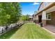 Lush front yard with green grass leading to a welcoming front porch at 1366 S Vine St, Denver, CO 80210