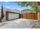 Detached two car garage with driveway and fenced yard at 1366 S Vine St, Denver, CO 80210