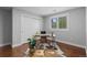 Home office features hardwood floors, neutral walls, closet, and window with natural light at 1366 S Vine St, Denver, CO 80210