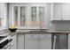 Granite countertops, stainless steel appliances, and abundant natural light create an inviting kitchen space at 1366 S Vine St, Denver, CO 80210
