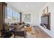 Cozy living room featuring a gray sofa and large windows at 22345 E 6Th Ave, Aurora, CO 80018