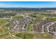 Expansive aerial view of the neighborhood, open space, mountains in the distance, and more at 4378 Fell Mist Way, Castle Rock, CO 80109