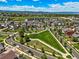 Picturesque aerial view of community, showcasing the manicured green spaces and nearby homes at 4378 Fell Mist Way, Castle Rock, CO 80109
