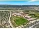 Extensive aerial view showcases the neighborhood's proximity to a school and recreation fields at 4378 Fell Mist Way, Castle Rock, CO 80109
