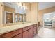 Bathroom with vanity, sink, and mosaic tile backsplash, and neutral paint at 4378 Fell Mist Way, Castle Rock, CO 80109