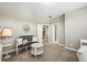 Relaxing bedroom featuring stylish seating and multiple access doors at 4378 Fell Mist Way, Castle Rock, CO 80109