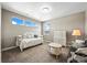 Cozy bedroom with a daybed, dresser, and ample natural light at 4378 Fell Mist Way, Castle Rock, CO 80109
