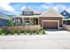 Charming home exterior with a spacious yard, covered patio, and two-car garage at 4378 Fell Mist Way, Castle Rock, CO 80109