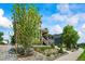 Beautiful two-story home with inviting front porch, stone accents, and professionally landscaped yard at 4378 Fell Mist Way, Castle Rock, CO 80109