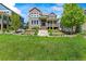Beautiful two-story home with stone accents, a charming front porch, and well-maintained landscaping at 4378 Fell Mist Way, Castle Rock, CO 80109