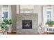 Close-up of the stone fireplace in the living room, creating a warm and inviting focal point at 4378 Fell Mist Way, Castle Rock, CO 80109