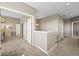 Hallway showcasing neutral paint, carpet flooring, and an open doorway to bedroom at 4378 Fell Mist Way, Castle Rock, CO 80109