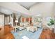 Bright and spacious living room with hardwood floors, neutral decor, and an open floor plan layout at 4378 Fell Mist Way, Castle Rock, CO 80109