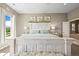Comfortable main bedroom with bed, lamps, and views of the outside at 4378 Fell Mist Way, Castle Rock, CO 80109