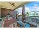 Covered porch with a seating area, fire pit, colorful rug and fan at 4378 Fell Mist Way, Castle Rock, CO 80109
